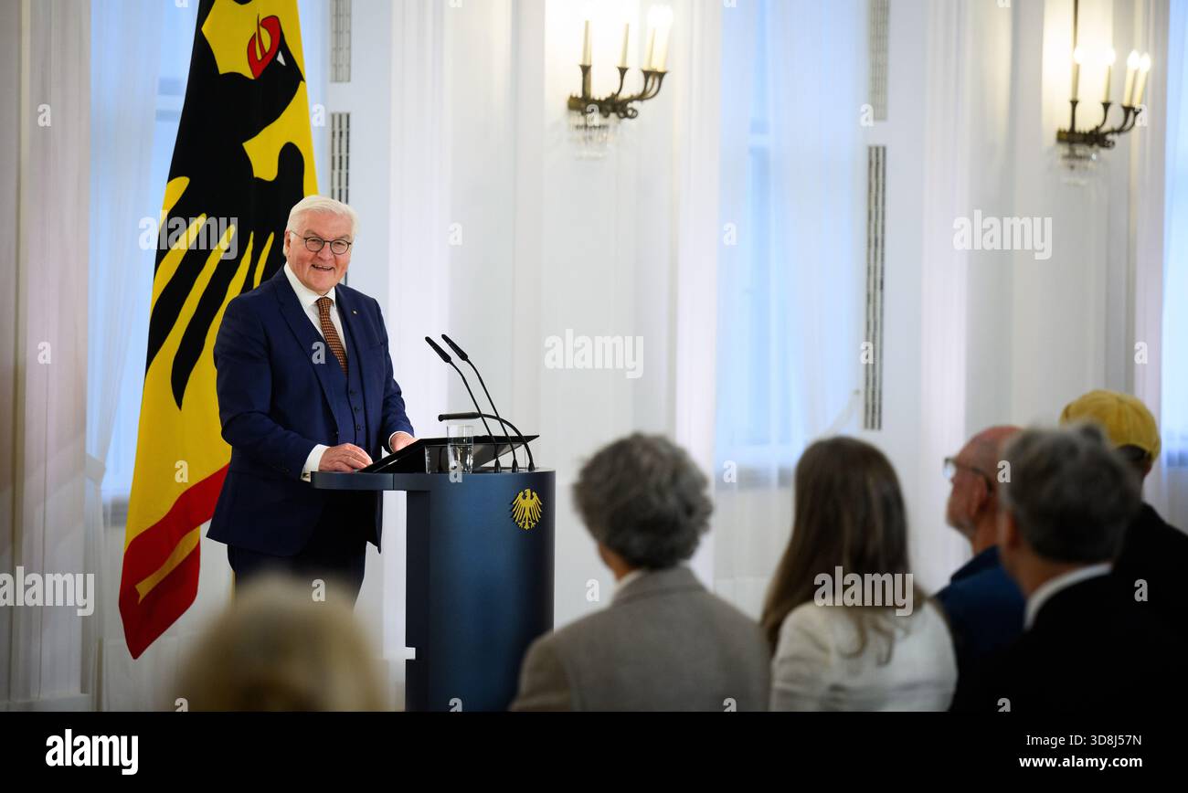 Berlin, Germany. 01st Dec, 2025. Federal President Frank-Walter Steinmeier speaks at the beginning of the award ceremony for the Order of Merit of the Federal Republic of Germany at Bellevue Palace. Under the motto 'Germany in the World', the Federal President is today awarding the Order of Merit to eleven women and nine men for their outstanding commitment on International Volunteer Day on December 5. Credit: Bernd von Jutrczenka/dpa/Alamy Live News Stock Photo