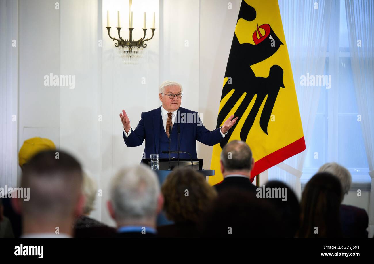Berlin, Germany. 01st Dec, 2025. Federal President Frank-Walter Steinmeier speaks at the beginning of the award ceremony for the Order of Merit of the Federal Republic of Germany at Bellevue Palace. Under the motto 'Germany in the World', the Federal President is today awarding the Order of Merit to eleven women and nine men for their outstanding commitment on International Volunteer Day on December 5. Credit: Bernd von Jutrczenka/dpa/Alamy Live News Stock Photo