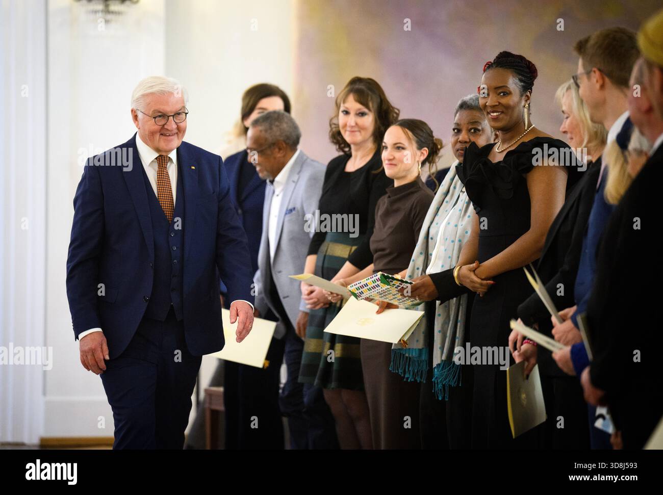 Berlin, Germany. 01st Dec, 2025. Federal President Frank-Walter Steinmeier attends the presentation of the Order of Merit of the Federal Republic of Germany at Bellevue Palace. Under the motto 'Germany in the World', the Federal President will today award the Order of Merit to eleven women and nine men for their outstanding commitment on International Volunteer Day on December 5. Credit: Bernd von Jutrczenka/dpa/Alamy Live News Stock Photo