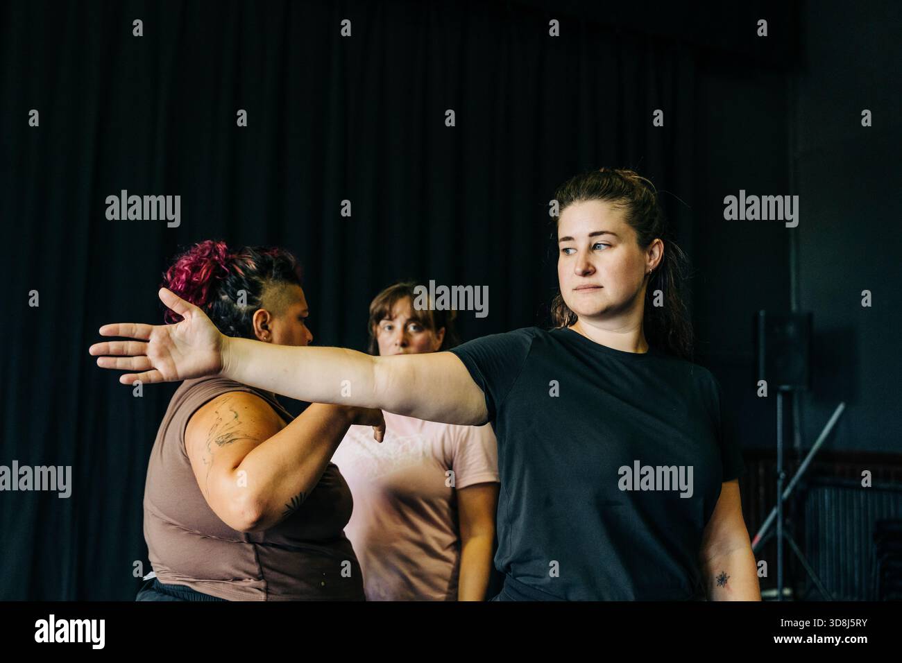 Women rehearsing movement in a dance studio Stock Photo
