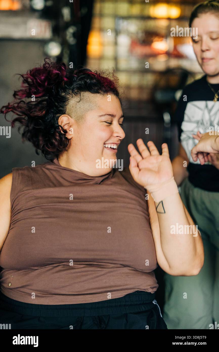 Happy woman laughing with shaved mohawk hairstyle Stock Photo - Alamy