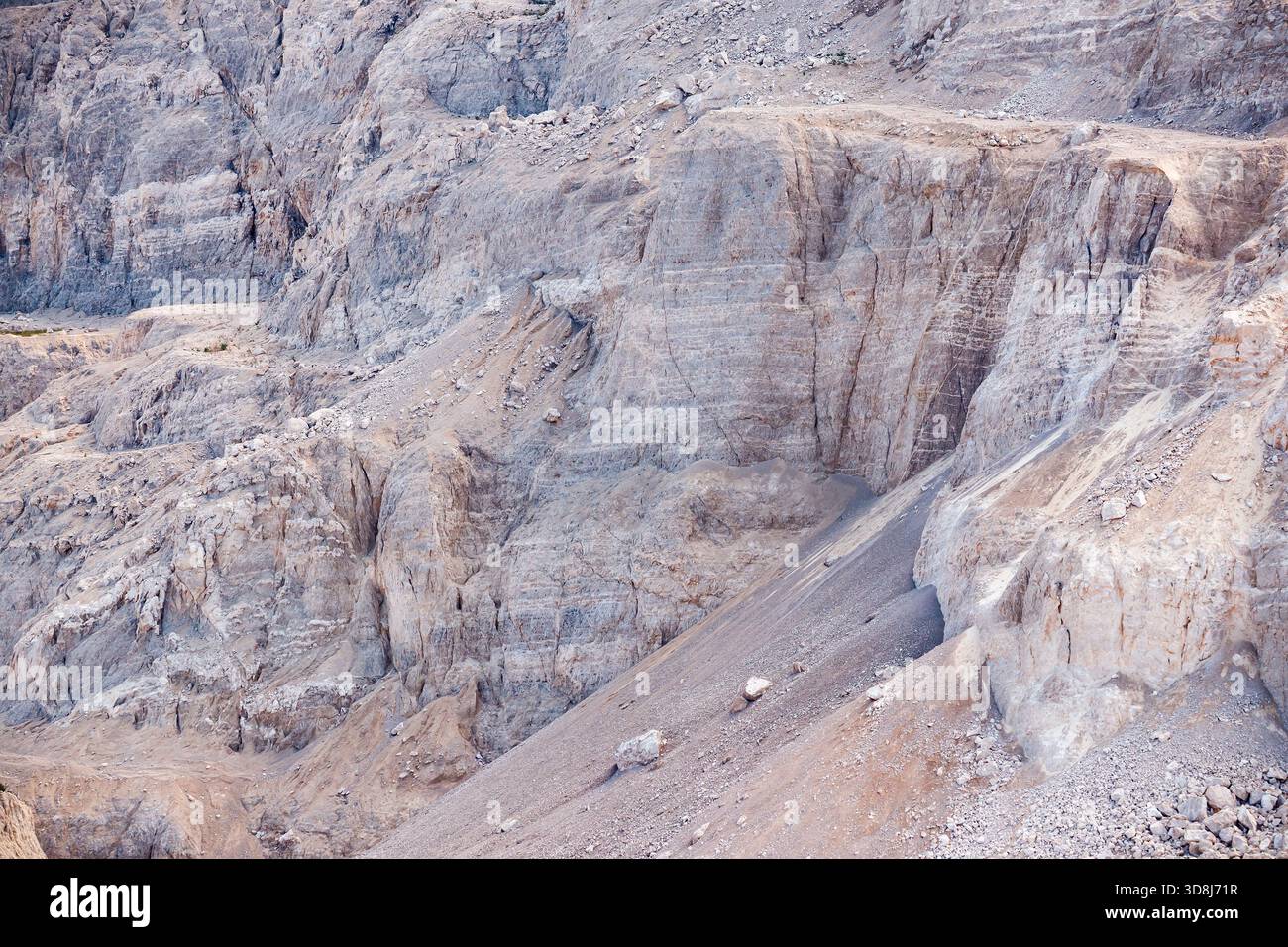 Grey and Beige Stratified Rock Slope Stock Photo
