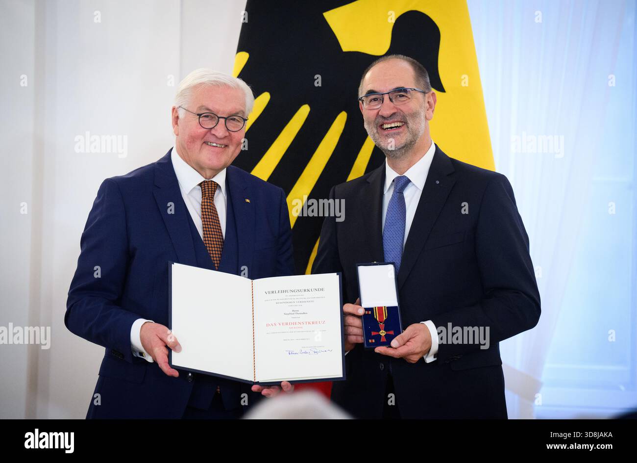 Berlin, Germany. 01st Dec, 2025. Federal President Frank-Walter Steinmeier awards Siegfried Thomaßen from Thönisvorst (North Rhine-Westphalia) the Order of Merit of the Federal Republic of Germany at Bellevue Palace. Under the motto 'Germany in the World', the Federal President is today awarding the Order of Merit to 11 women and 9 men for their outstanding commitment on International Volunteer Day on December 5. Credit: Bernd von Jutrczenka/dpa/Alamy Live News Stock Photo