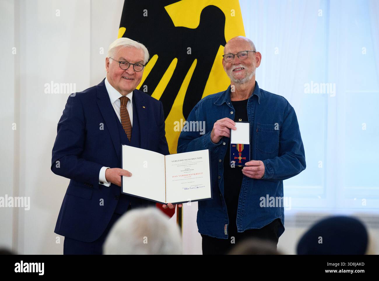 Berlin, Germany. 01st Dec, 2025. Federal President Frank-Walter Steinmeier awards Wolfhard Pröhl from Rudolstadt (Thuringia) the Order of Merit of the Federal Republic of Germany at Bellevue Palace. Under the motto 'Germany in the World', the Federal President is today awarding the Order of Merit to 11 women and 9 men for their outstanding commitment on International Volunteer Day on December 5. Credit: Bernd von Jutrczenka/dpa/Alamy Live News Stock Photo