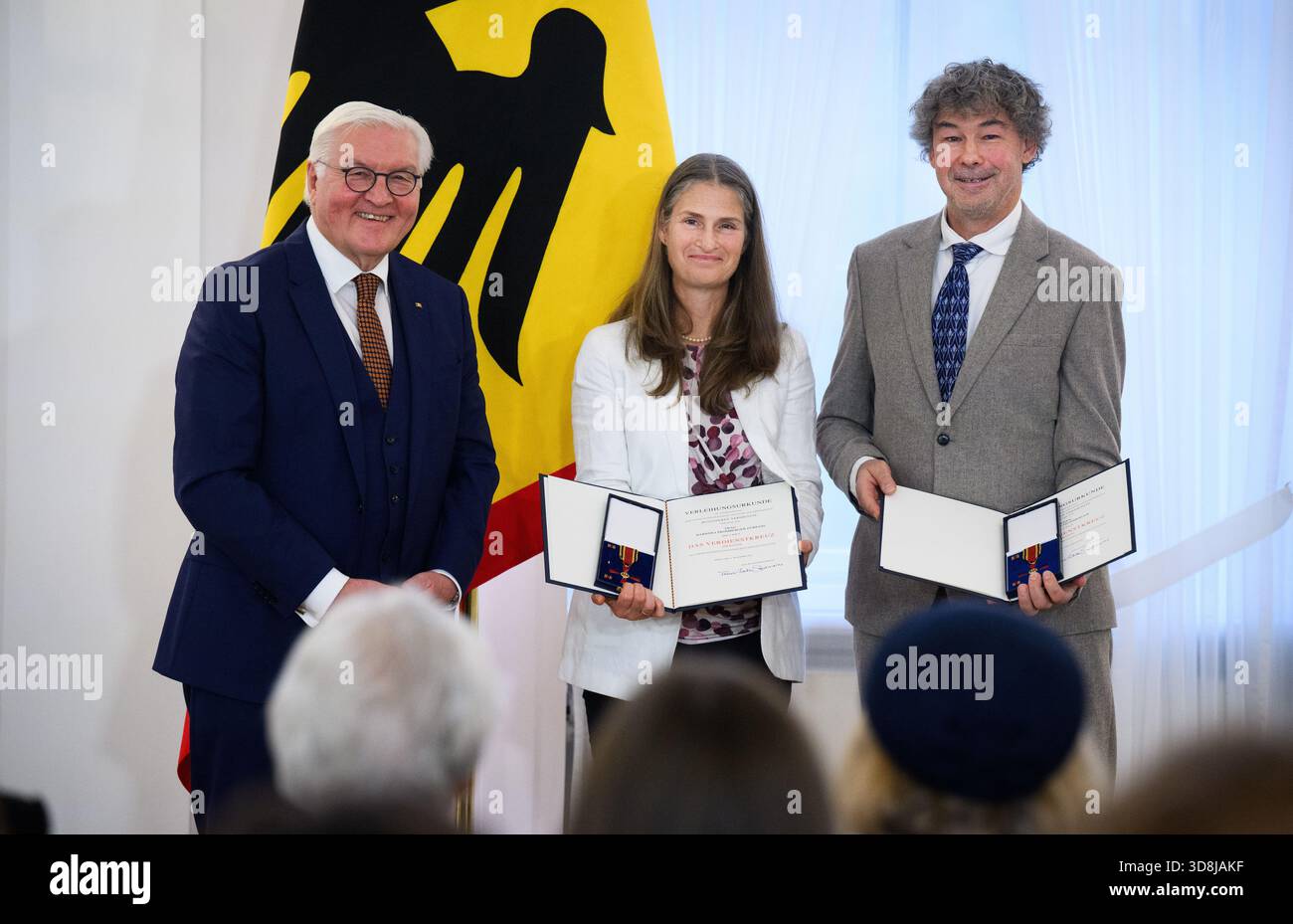 Berlin, Germany. 01st Dec, 2025. Federal President Frank-Walter Steinmeier awards Christoph Promberger and Barbara Promberger-Fürpass from Romania the Order of Merit of the Federal Republic of Germany at Bellevue Palace. Under the motto 'Germany in the World', the Federal President is today awarding the Order of Merit to 11 women and 9 men for their outstanding commitment on International Volunteer Day on December 5. Credit: Bernd von Jutrczenka/dpa/Alamy Live News Stock Photo