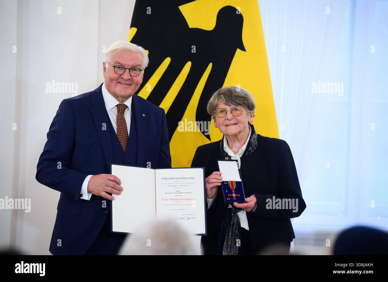 Berlin, Germany. 01st Dec, 2025. Federal President Frank-Walter Steinmeier awards Alena Wagnerová-Köhler from Saarbrücken (Saarland) the Order of Merit of the Federal Republic of Germany at Bellevue Palace. Under the motto 'Germany in the World', the Federal President is today awarding the Order of Merit to 11 women and 9 men for their outstanding commitment on International Volunteer Day on December 5. Credit: Bernd von Jutrczenka/dpa/Alamy Live News Stock Photo
