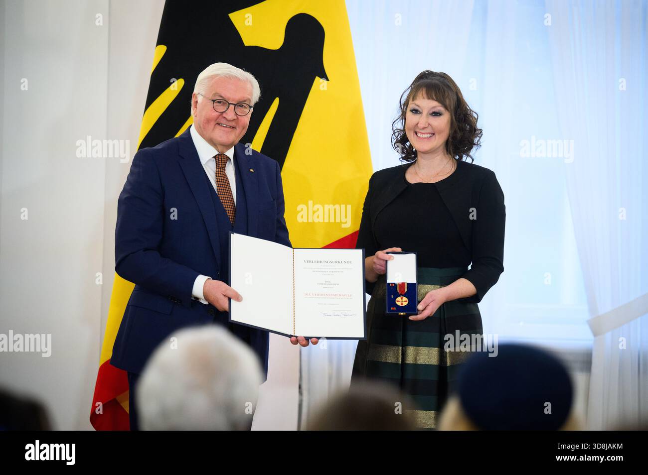 Berlin, Germany. 01st Dec, 2025. Federal President Frank-Walter Steinmeier awards Vanessa Holdysz from Immenstedt (Schleswig-Holstein) the Order of Merit of the Federal Republic of Germany at Bellevue Palace. Under the motto 'Germany in the World', the Federal President is today awarding the Order of Merit to 11 women and 9 men for their outstanding commitment on International Volunteer Day on December 5. Credit: Bernd von Jutrczenka/dpa/Alamy Live News Stock Photo