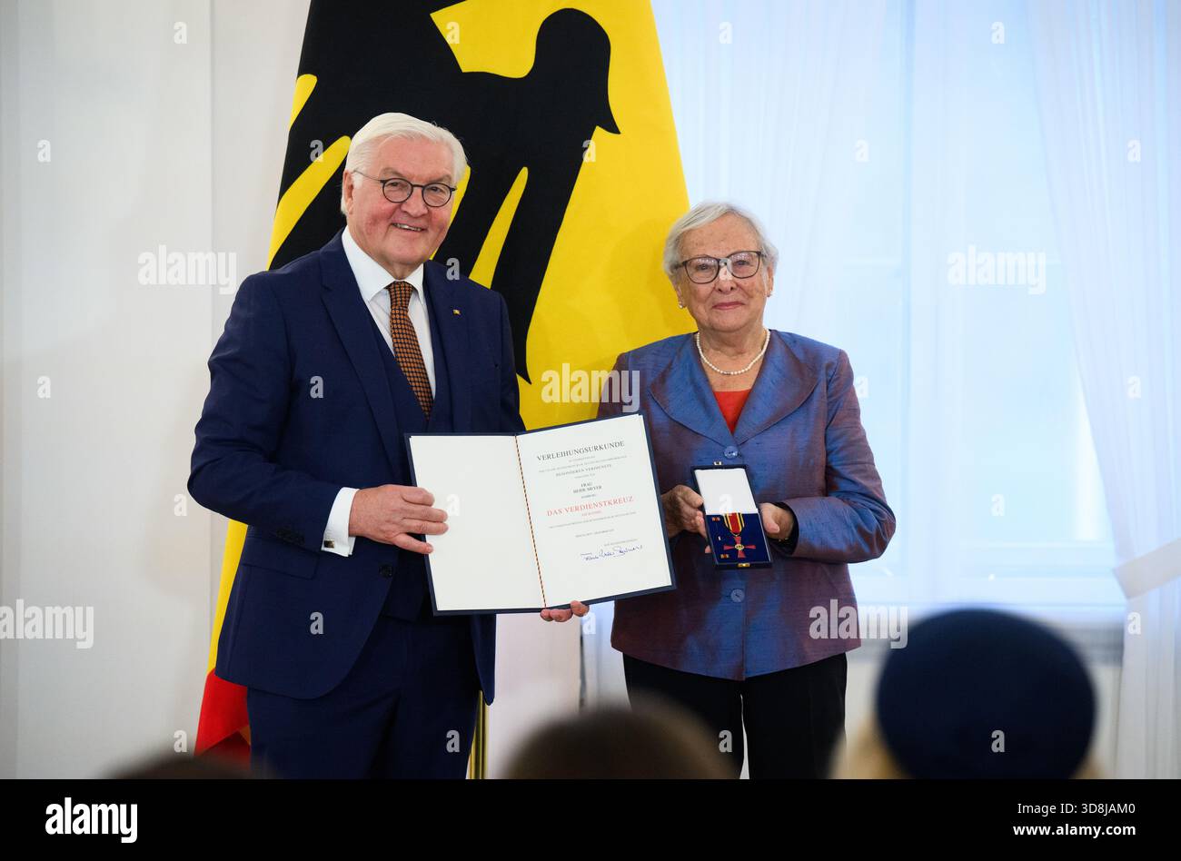 Berlin, Germany. 01st Dec, 2025. Federal President Frank-Walter Steinmeier awards Heide Meyer from Hamburg the Order of Merit of the Federal Republic of Germany at Bellevue Palace. Under the motto 'Germany in the World', the Federal President is today awarding 11 women and 9 men the Order of Merit for their outstanding commitment on International Volunteer Day on December 5. Credit: Bernd von Jutrczenka/dpa/Alamy Live News Stock Photo