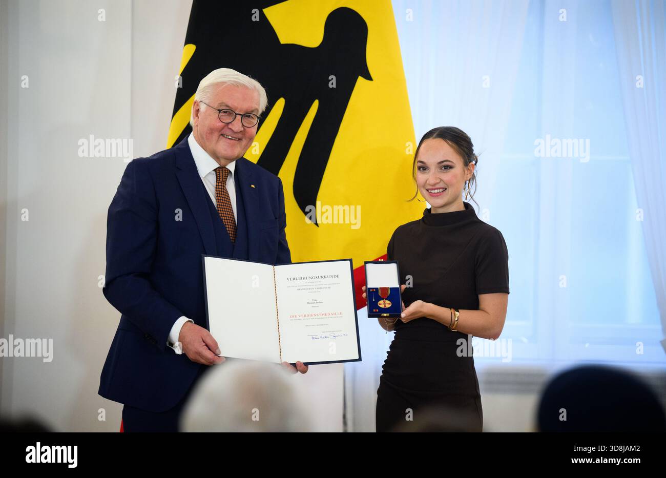 Berlin, Germany. 01st Dec, 2025. Federal President Frank-Walter Steinmeier awards Vanessa Hannah Janßen from Hanover (Lower Saxony) the Order of Merit of the Federal Republic of Germany at Bellevue Palace. Under the motto 'Germany in the World', the Federal President is today awarding the Order of Merit to 11 women and 9 men for their outstanding commitment on International Volunteer Day on December 5. Credit: Bernd von Jutrczenka/dpa/Alamy Live News Stock Photo