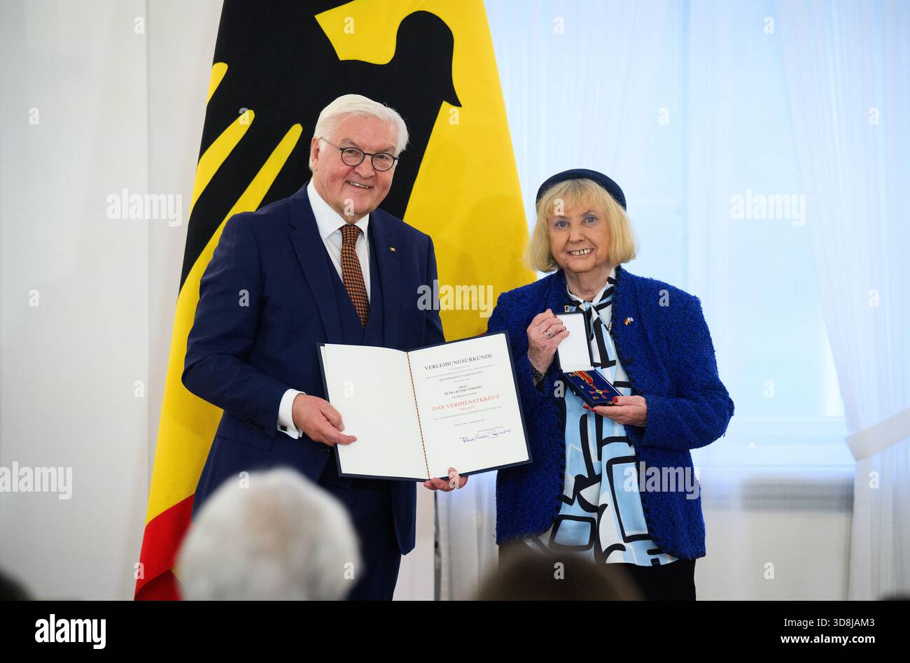 Berlin, Germany. 01st Dec, 2025. Federal President Frank-Walter Steinmeier awards Petra Kunik-Vornoff from Frankfurt am Main (Hesse) the Order of Merit of the Federal Republic of Germany at Bellevue Palace. Under the motto 'Germany in the World', the Federal President is today awarding the Order of Merit to 11 women and 9 men for their outstanding commitment on International Volunteer Day on December 5. Credit: Bernd von Jutrczenka/dpa/Alamy Live News Stock Photo