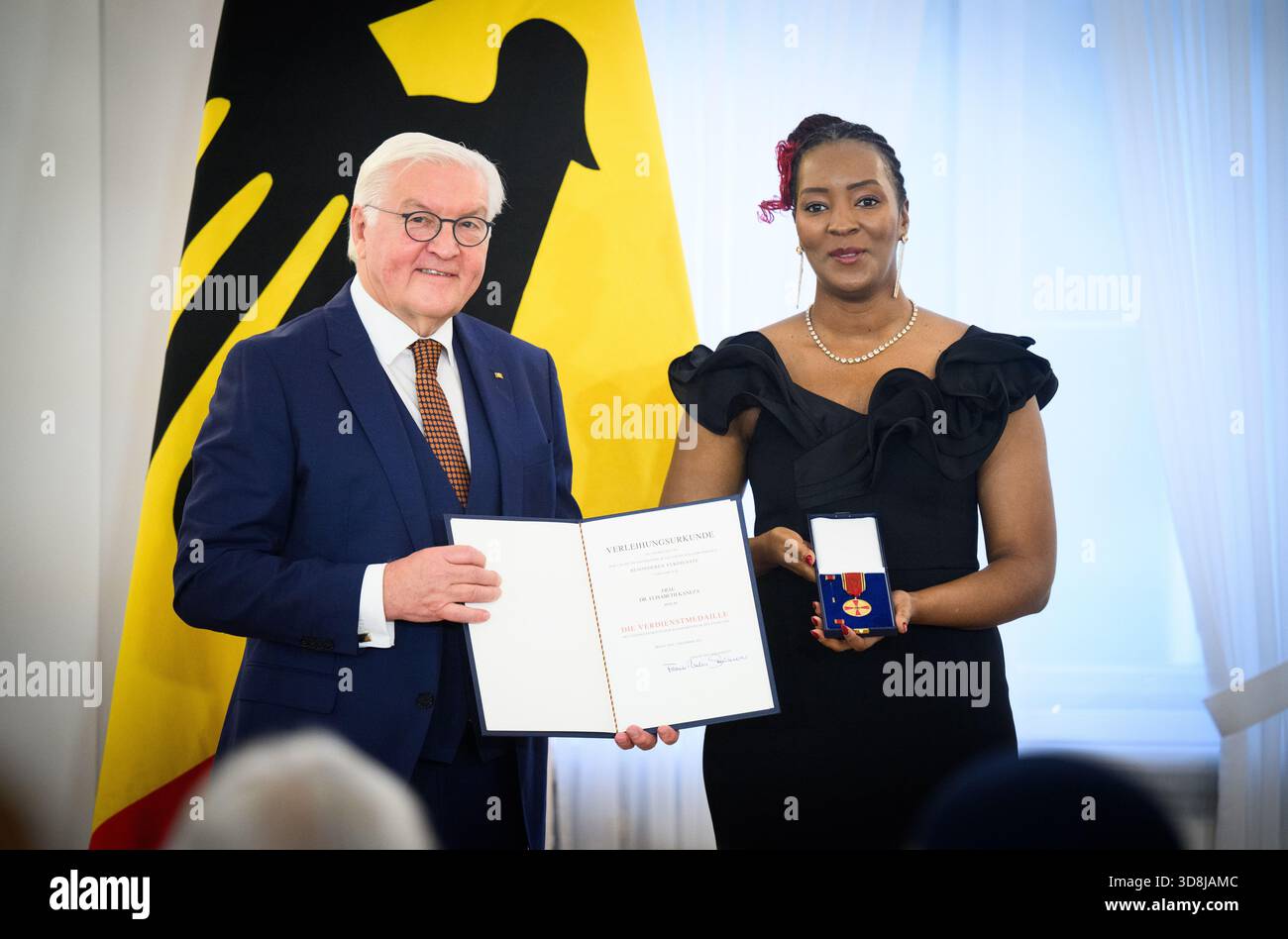 Berlin, Germany. 01st Dec, 2025. Federal President Frank-Walter Steinmeier awards Elisabeth Kaneza from Berlin the Order of Merit of the Federal Republic of Germany at Bellevue Palace. Under the motto 'Germany in the World', the Federal President is today awarding the Order of Merit to 11 women and 9 men for their outstanding commitment on International Volunteer Day on December 5. Credit: Bernd von Jutrczenka/dpa/Alamy Live News Stock Photo