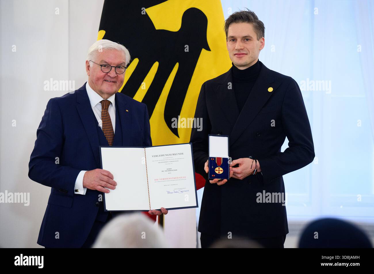 Berlin, Germany. 01st Dec, 2025. Federal President Frank-Walter Steinmeier awards Theodor Rüber from Bonn (North Rhine-Westphalia) the Order of Merit of the Federal Republic of Germany at Bellevue Palace. Under the motto 'Germany in the World', the Federal President is today awarding the Order of Merit to 11 women and 9 men for their outstanding commitment on International Volunteer Day on December 5. Credit: Bernd von Jutrczenka/dpa/Alamy Live News Stock Photo