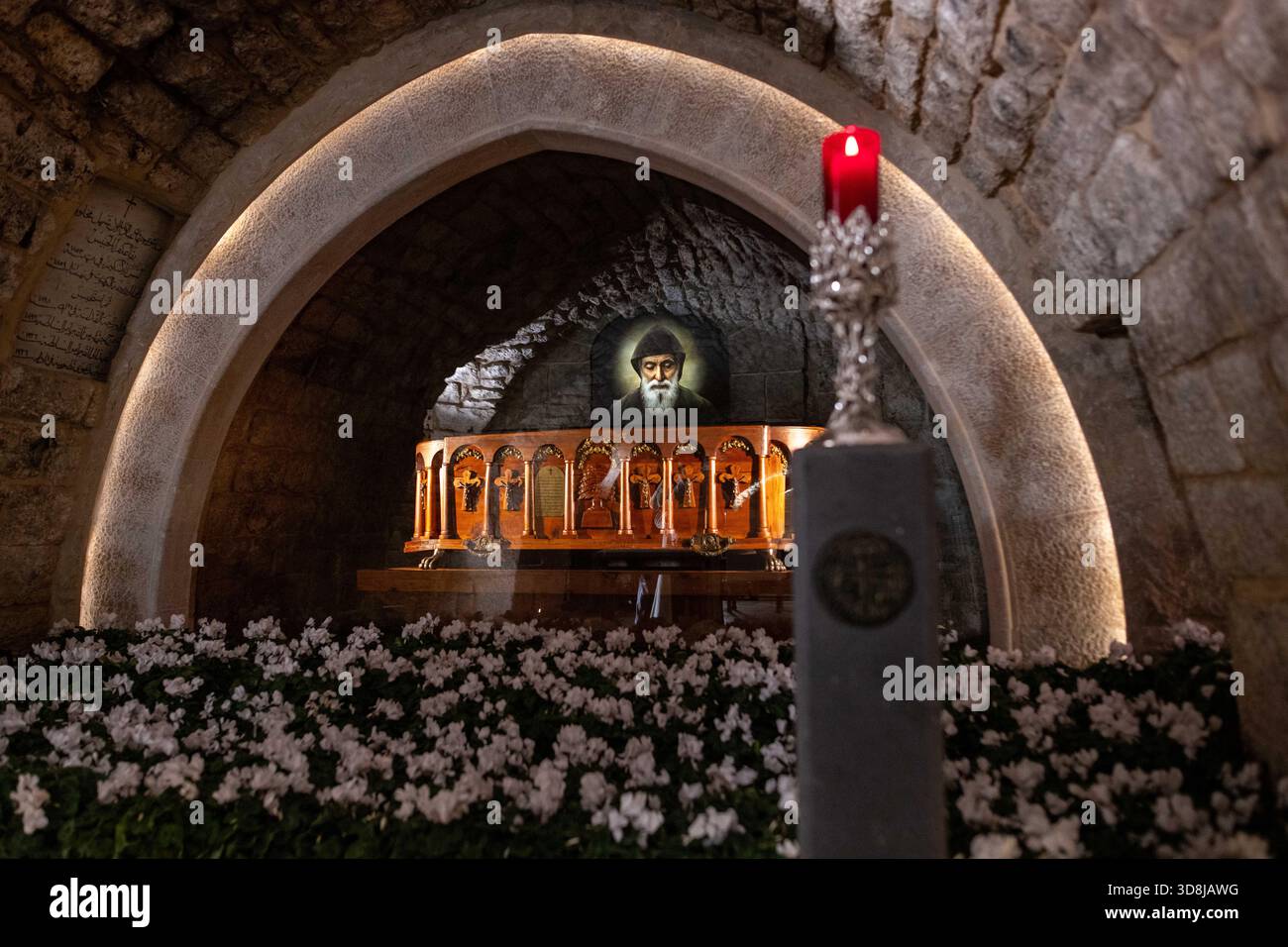 Annaya, Pomeranian Voivodeship, Lebanon. 1st Dec, 2025. The Saint Maroun Monastery in Annaya, Lebanon, is a historic Maronite Christian site, home to the tomb of Saint Charbel, a highly venerated Lebanese monk. Pilgrims from across the world come to the monastery to pray, receive blessings, and experience its serene spiritual atmosphere. Inside, a votive candle burns before Saint Charbel's tomb, where visitors gather to offer prayers and seek blessings. Credit: ZUMA Press, Inc./Alamy Live News Stock Photo