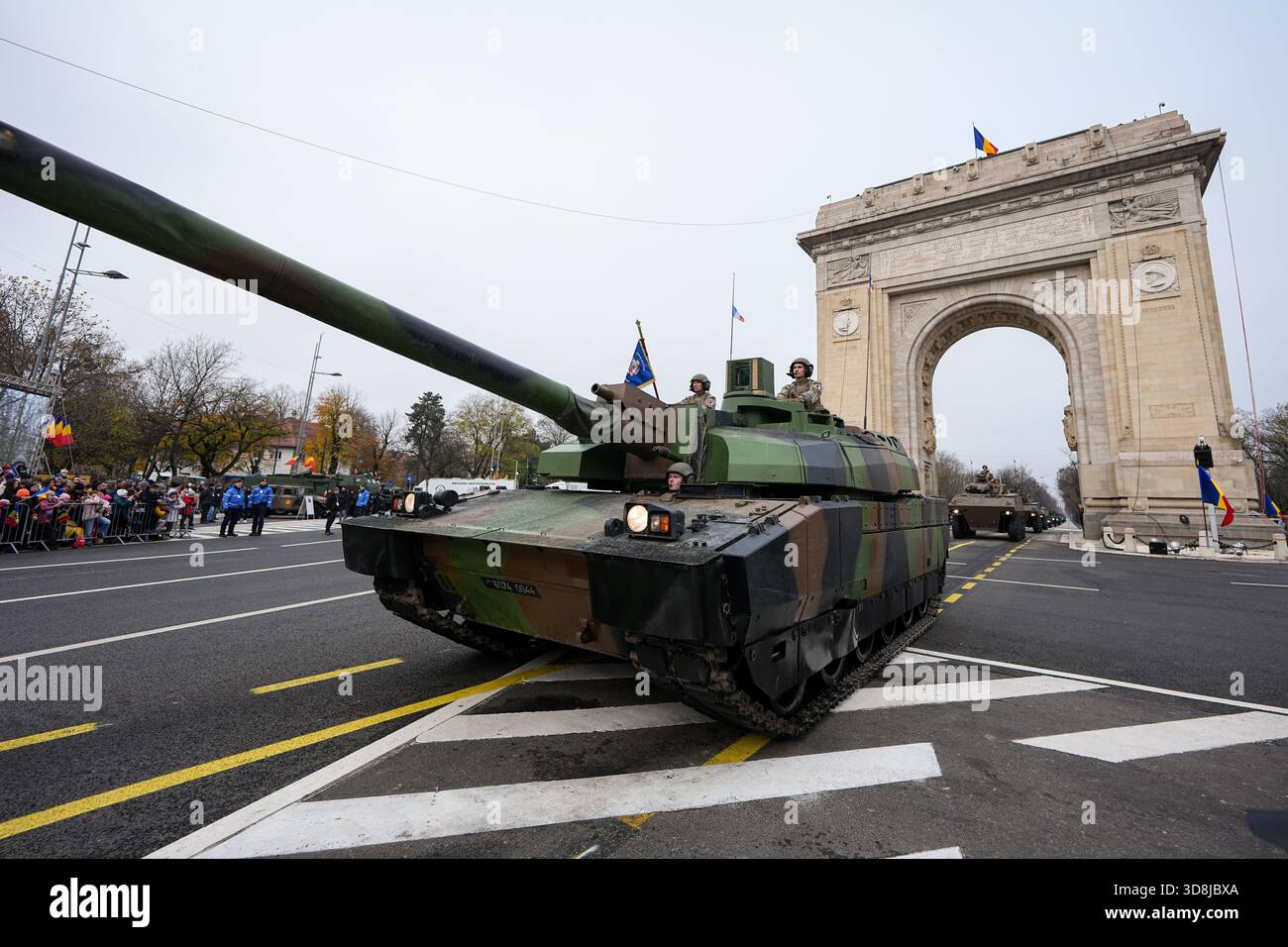 Tanks and armoured vehicles drive under the Arc de Triomphe during the ...