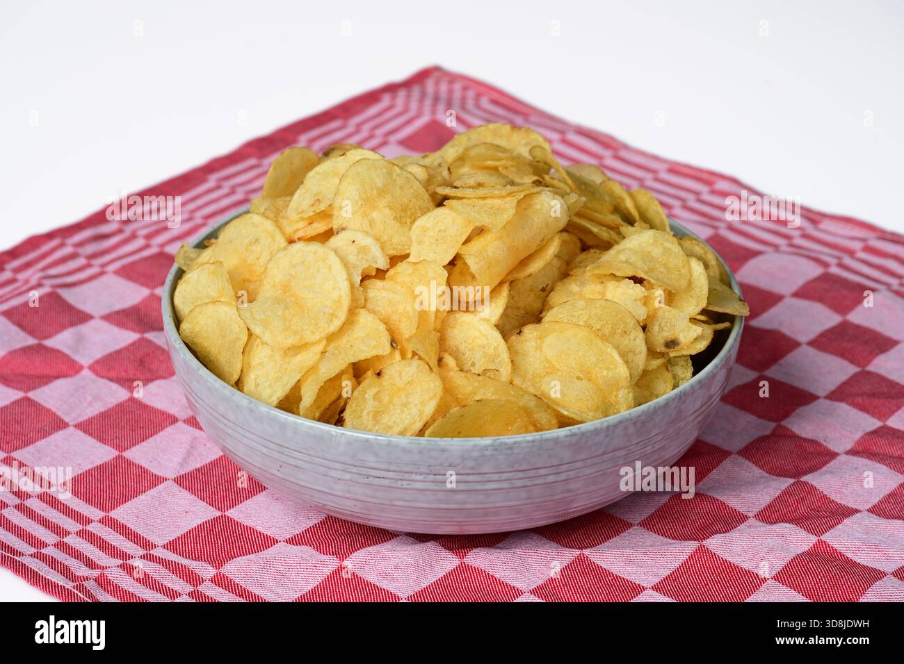Potato chips in bowl Stock Photo