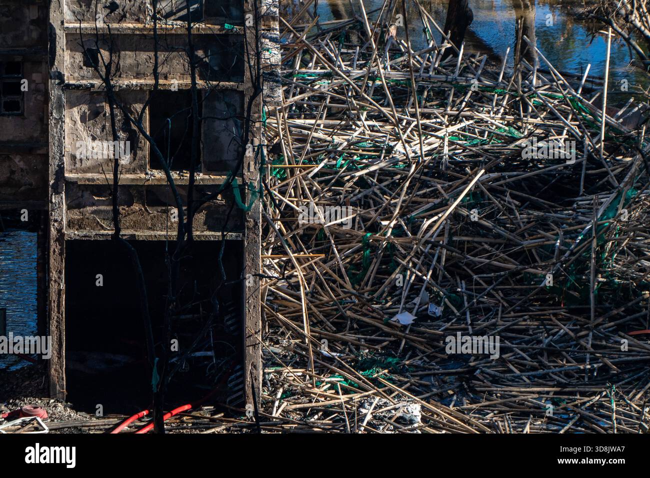 Hong Kong. 1 Dec, 2025. Debris on the ground near one of the burned buildings at Wang Fuk Court housing complex in Tai Po following a deadly fire on December 1, 2025 in Hong Kong. (Photo by Vernon Yuen/Nexpher Images) Credit: Nexpher Images Limited/Alamy Live News Credit: Nexpher Images Limited/Alamy Live News Stock Photo