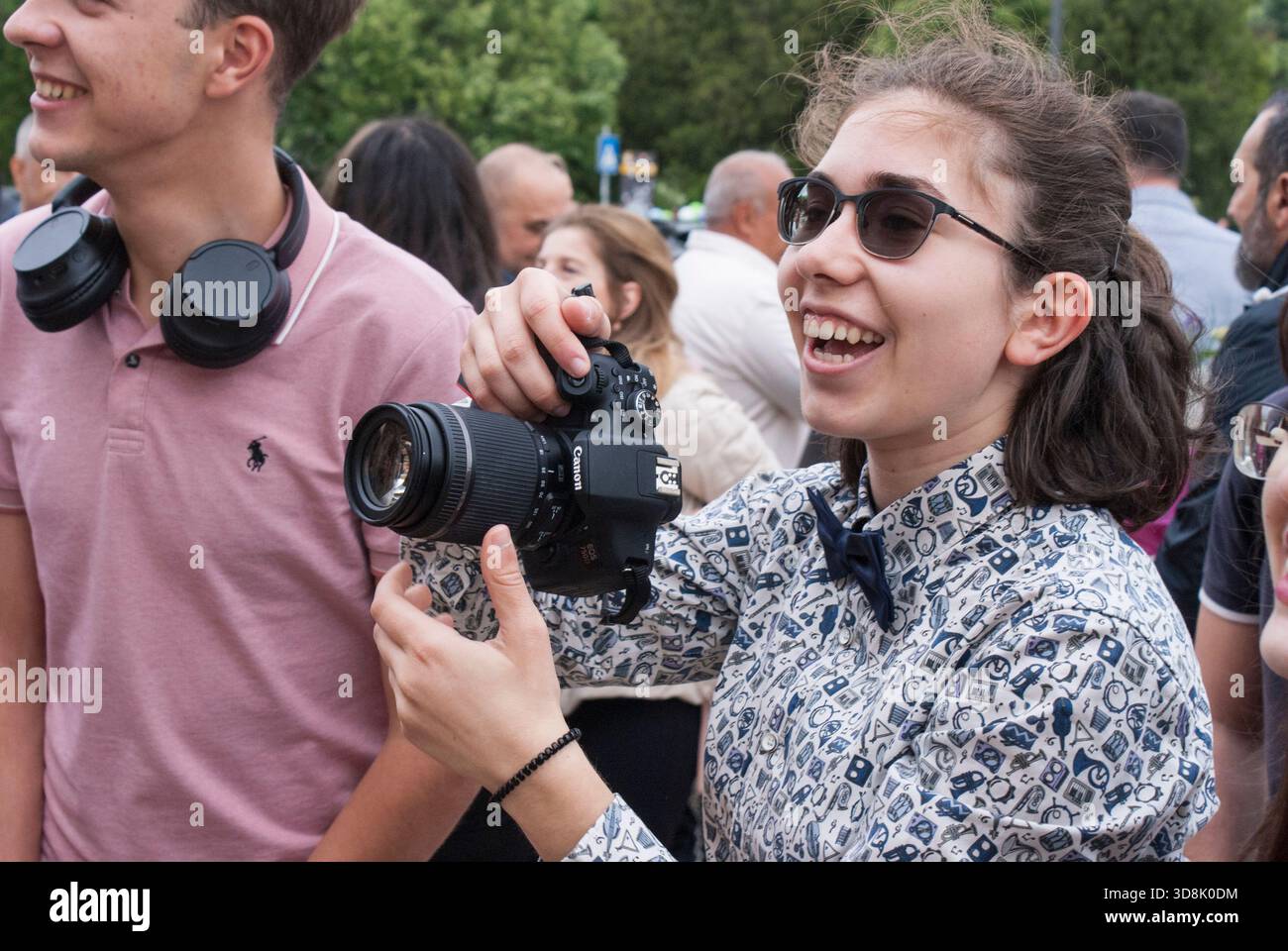 Female photographer in action. Stock Photo