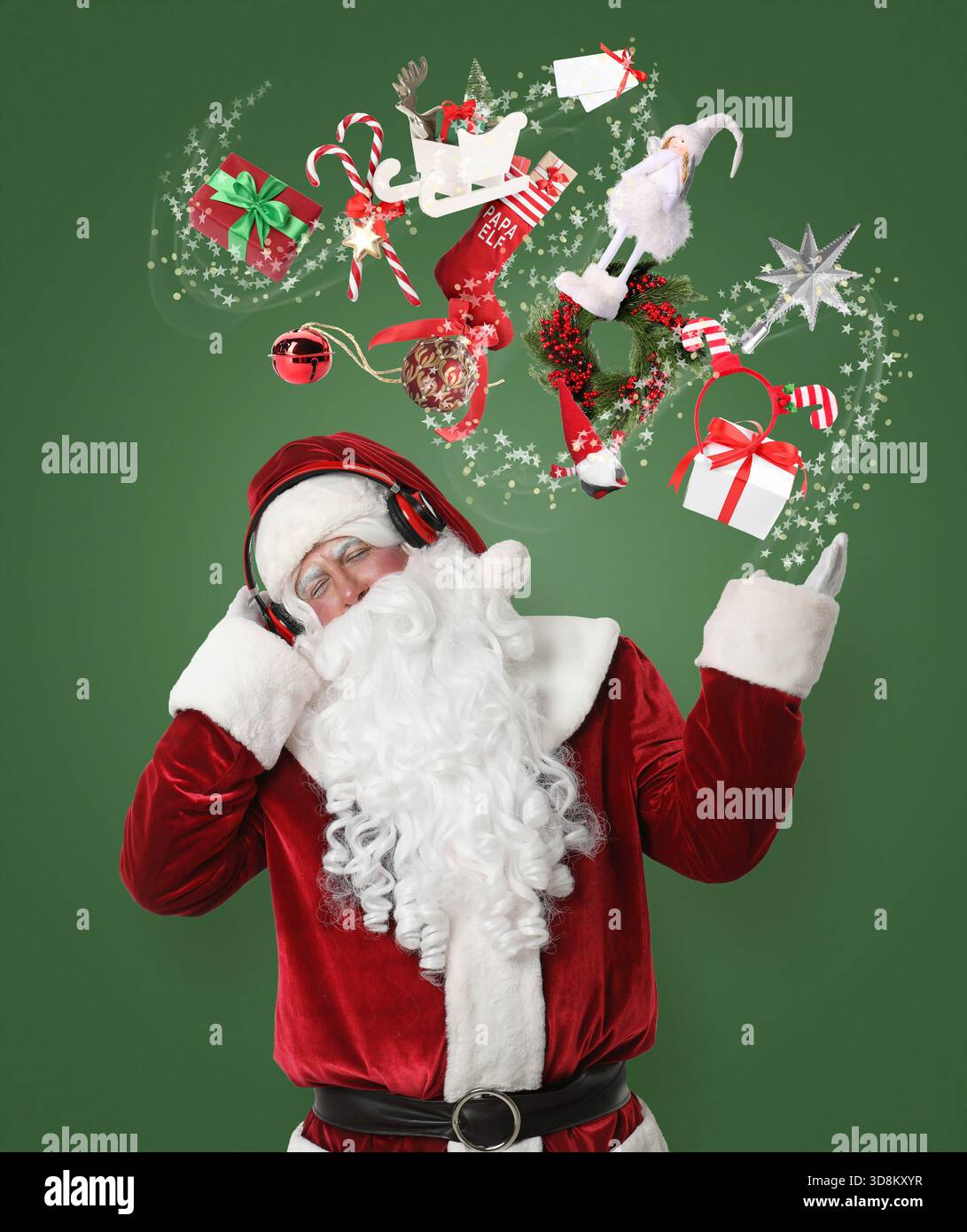 Santa Claus levitating Christmas decor and gift boxes while listening ...