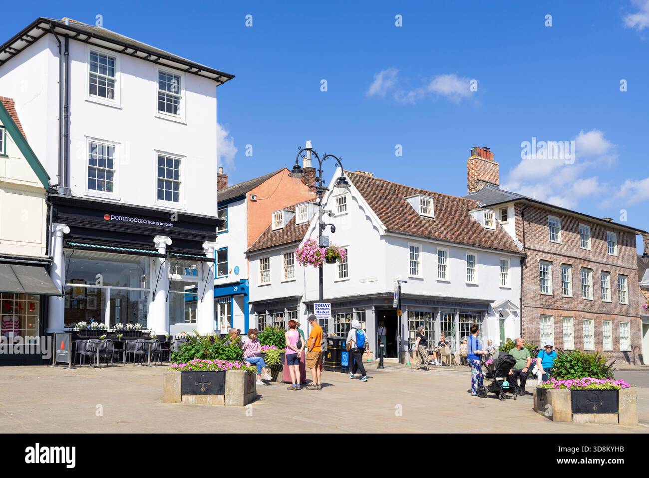 Bury St Edmunds Shops and Restaurants  with people on Abbeygate street and Angel Hill Bury St Edmunds Suffolk England UK GB Europe Stock Photo