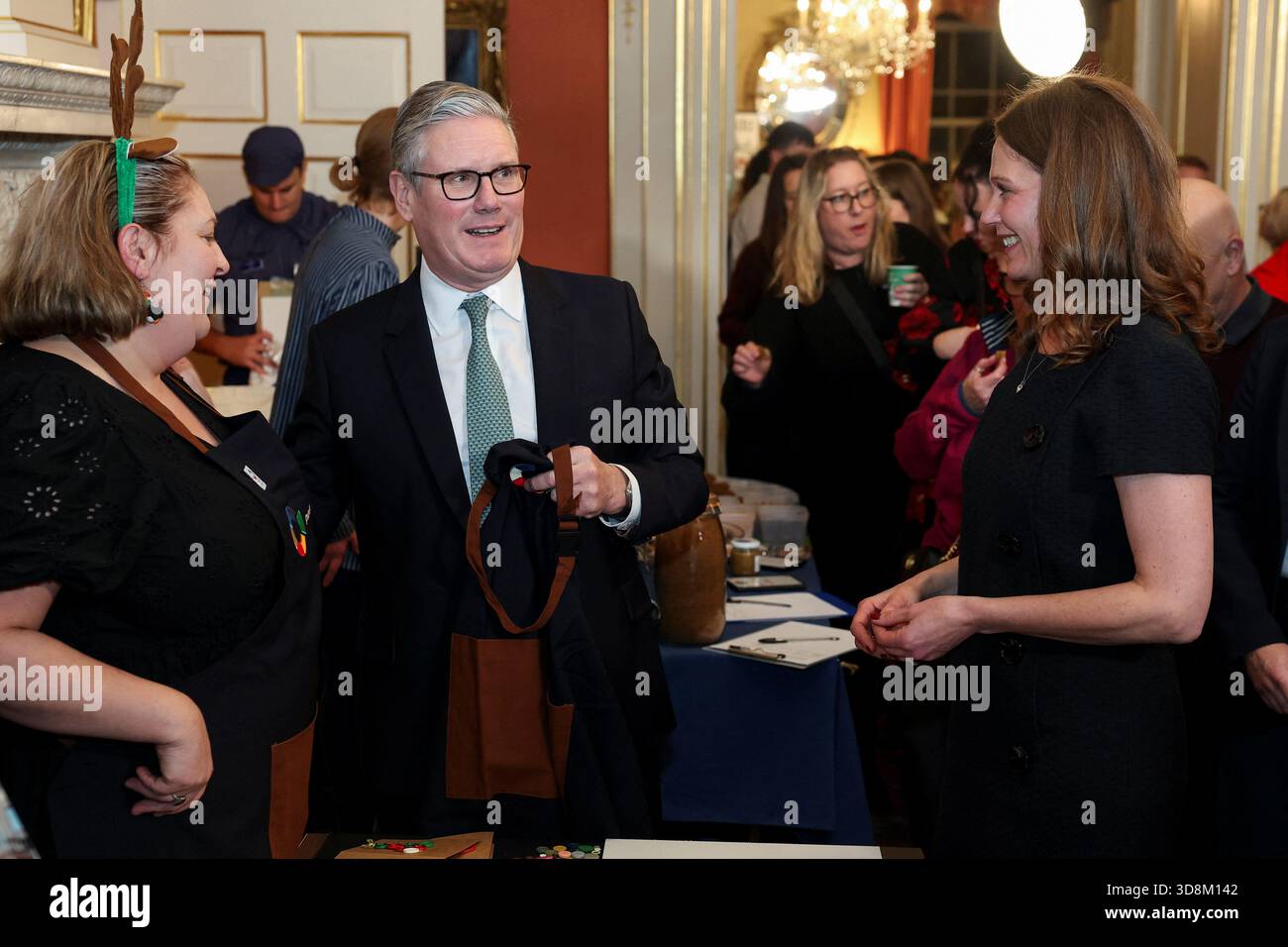 Prime Minister Sir Keir Starmer and his wife Lady Victoria Starmer (right) react as they host a Christmas market-style showcase for small firms and community champions in number 10 Downing Street, London. Picture date: Monday December 1, 2025. Stock Photo