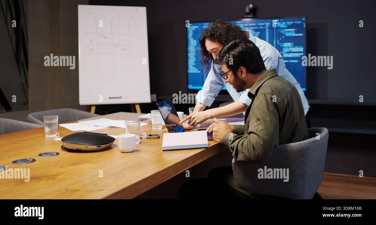 design review session, collaborative team deeply analyzing user interface designs and solutions Stock Photo