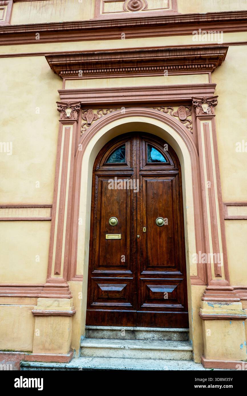 Romanesque style door in Siena, Italy. Stock Photo