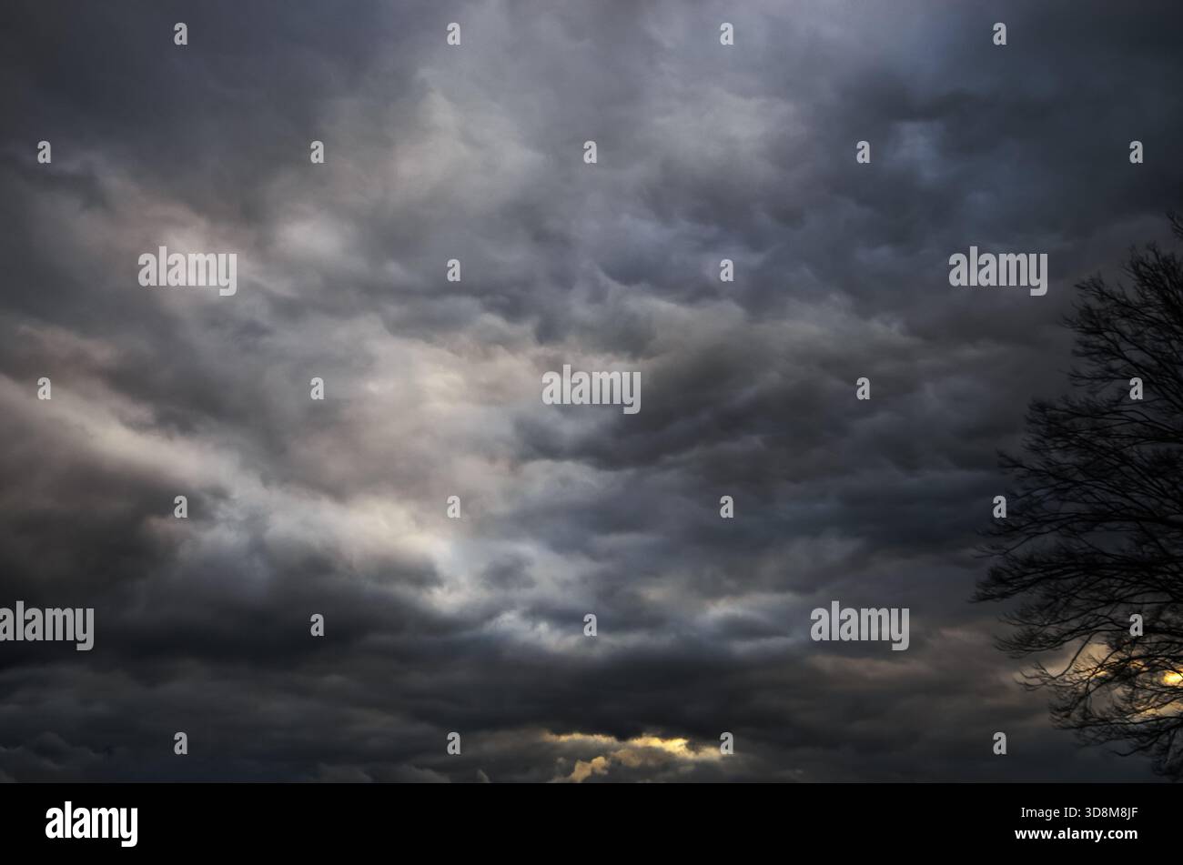 Dramatic storm clouds fill the sky with a sense of foreboding Stock Photo