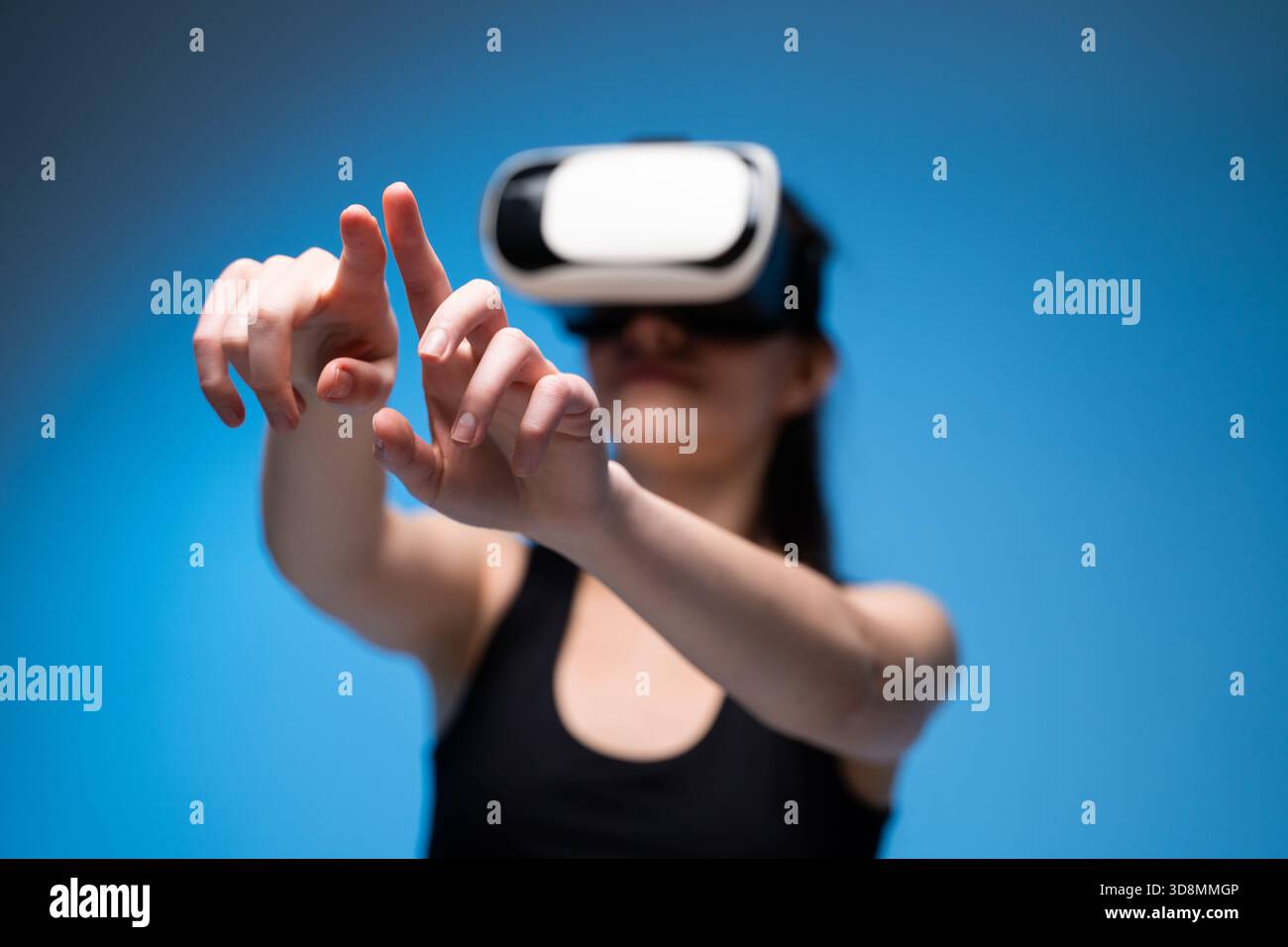 VR designer using hand gestures to manipulate virtual interface while crafting digital creative concepts Stock Photo