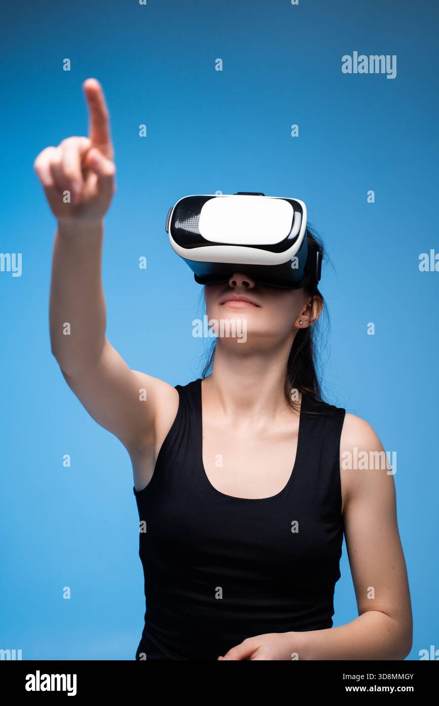 Architect Using VR Interface for 3D Project Interaction and Virtual Design Navigation in Futuristic Space Stock Photo