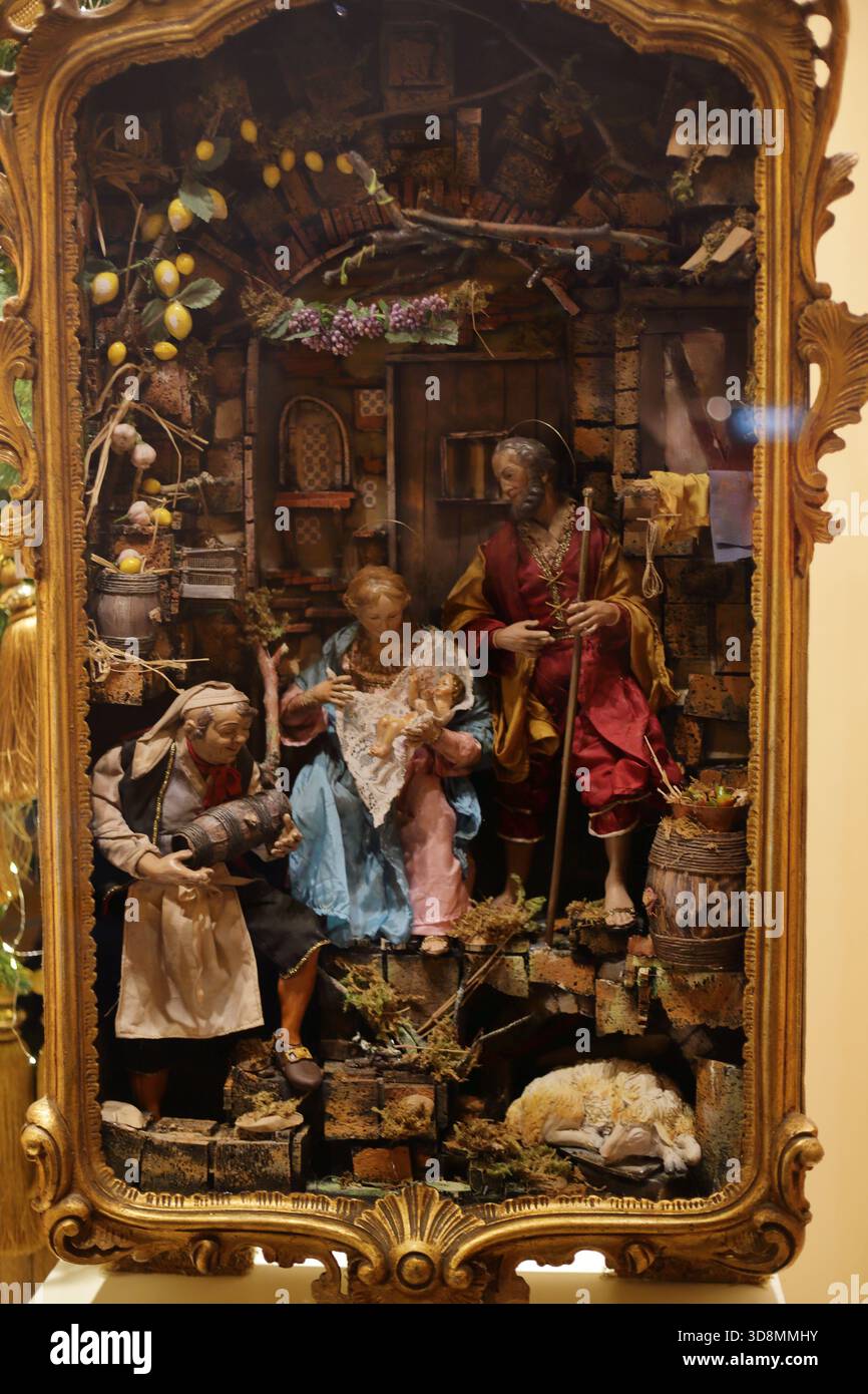 An artistic Neapolitan nativity scene seen set up in a shop window. - Stock Image