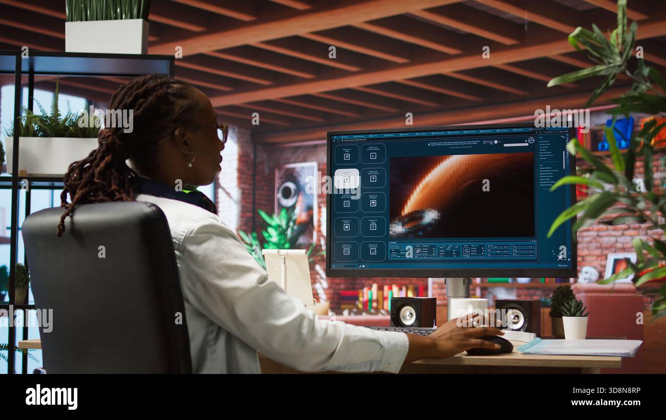 Woman at home using generative artificial intelligence website generating videos using diffusion models. Person drinking coffee and using AI virtual assistant producing clips, camera A Stock Photo