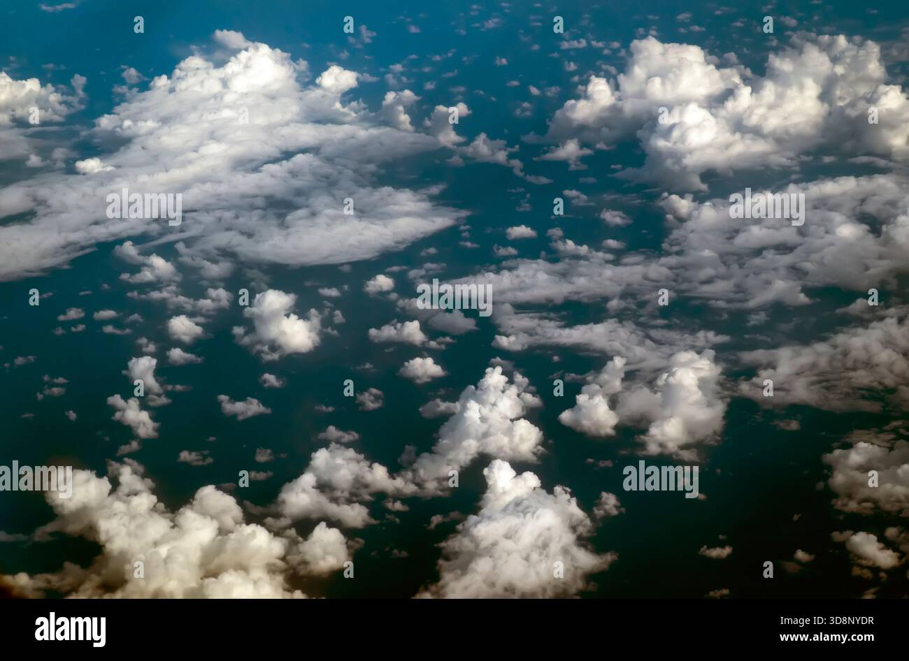 Aerial view of fluffy white clouds over a deep blue ocean Stock Photo ...