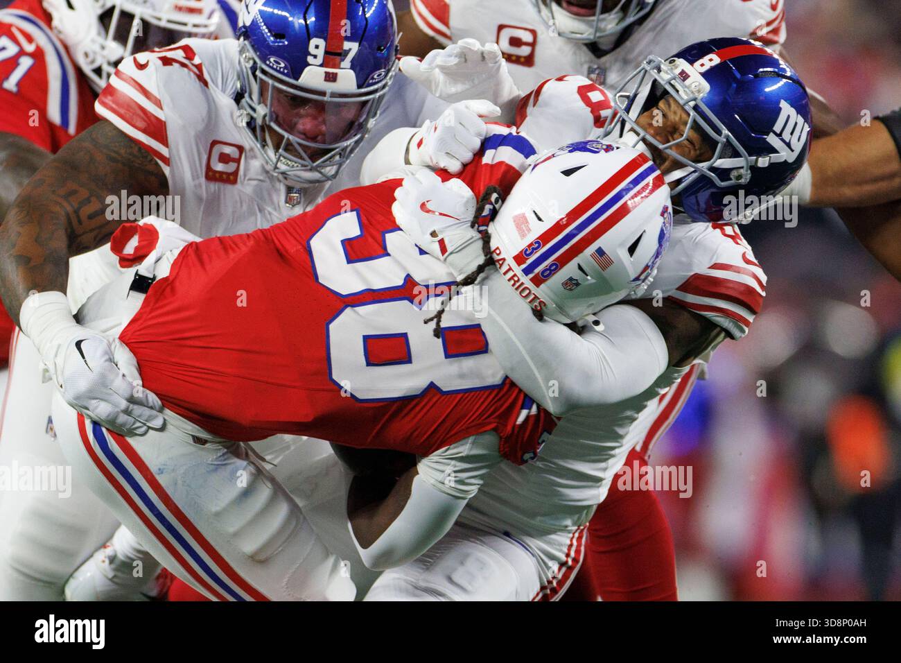 Foxborough, Massachusetts on Monday, December 01, 2025.New York Giants defensive tackle D.J. Davidson (R) takes down New England Patriots running back Rhamondre Stevenson (L) during the first half at Gillette Stadium in Foxborough, Massachusetts on Monday, December 01, 2025. Photo by CJ Gunther/UPI Credit: UPI/Alamy Live News Stock Photo
