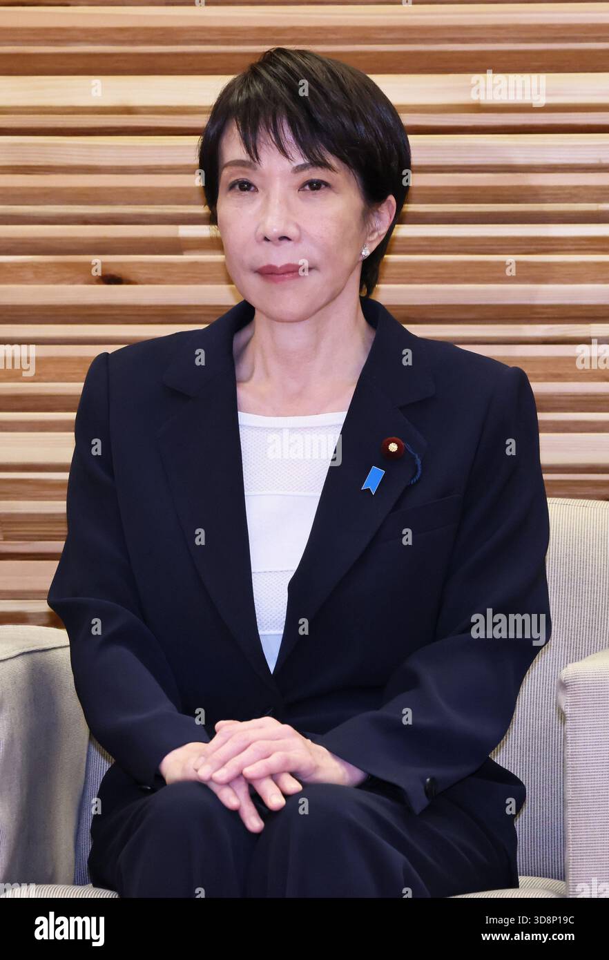 Japanese Prime Minister Sanae Takaichi (C) attends a cabinet meeting at ...