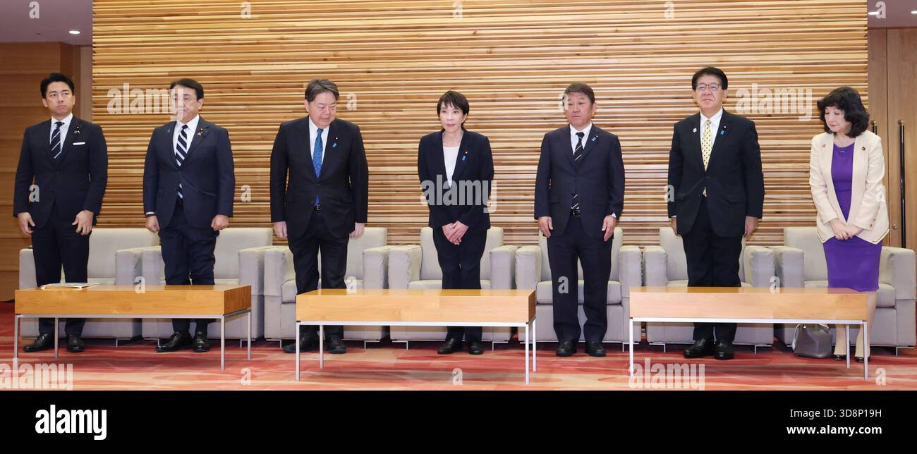 Japanese Prime Minister Sanae Takaichi (C) attends a cabinet meeting at ...