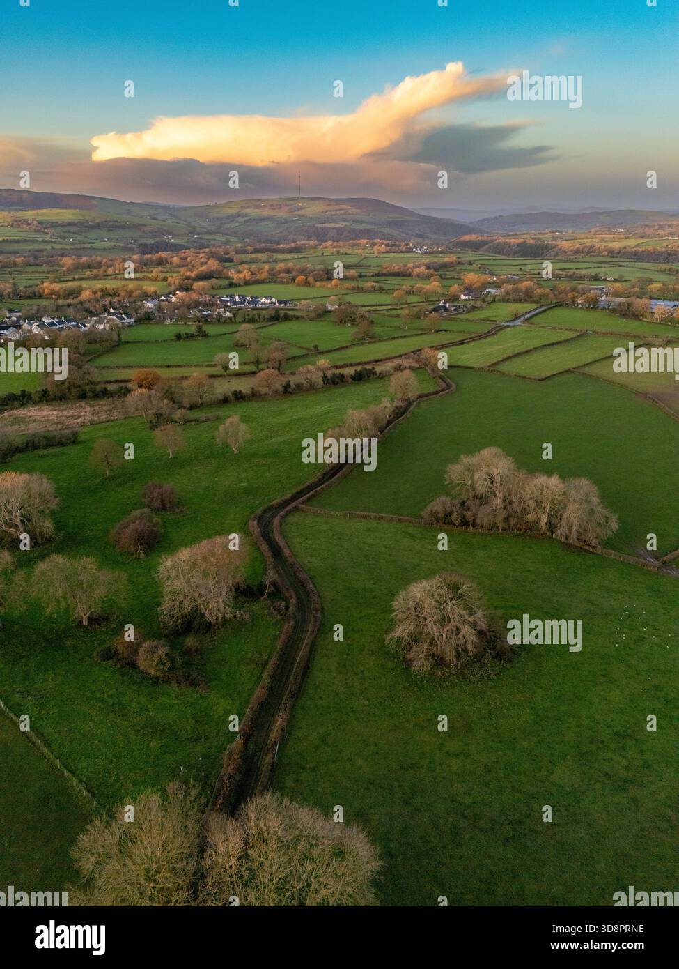 UK Weather:  Following the heaviest rainfall, the UK faces an unsettled week ahead with further downpours and cooler conditions. This morning, clear spells left much of the country in single-digit temperatures — vividly captured in Flintshire, North Wales. Near the village of Lixwm, the Clwydian Range Hills provided a dramatic backdrop at sunrise with rain clouds forming, offering striking visuals of the shifting weather front. 2nd December 2025 , Flintshire, Wales ©DGDImages/Alamy Live News Stock Photo