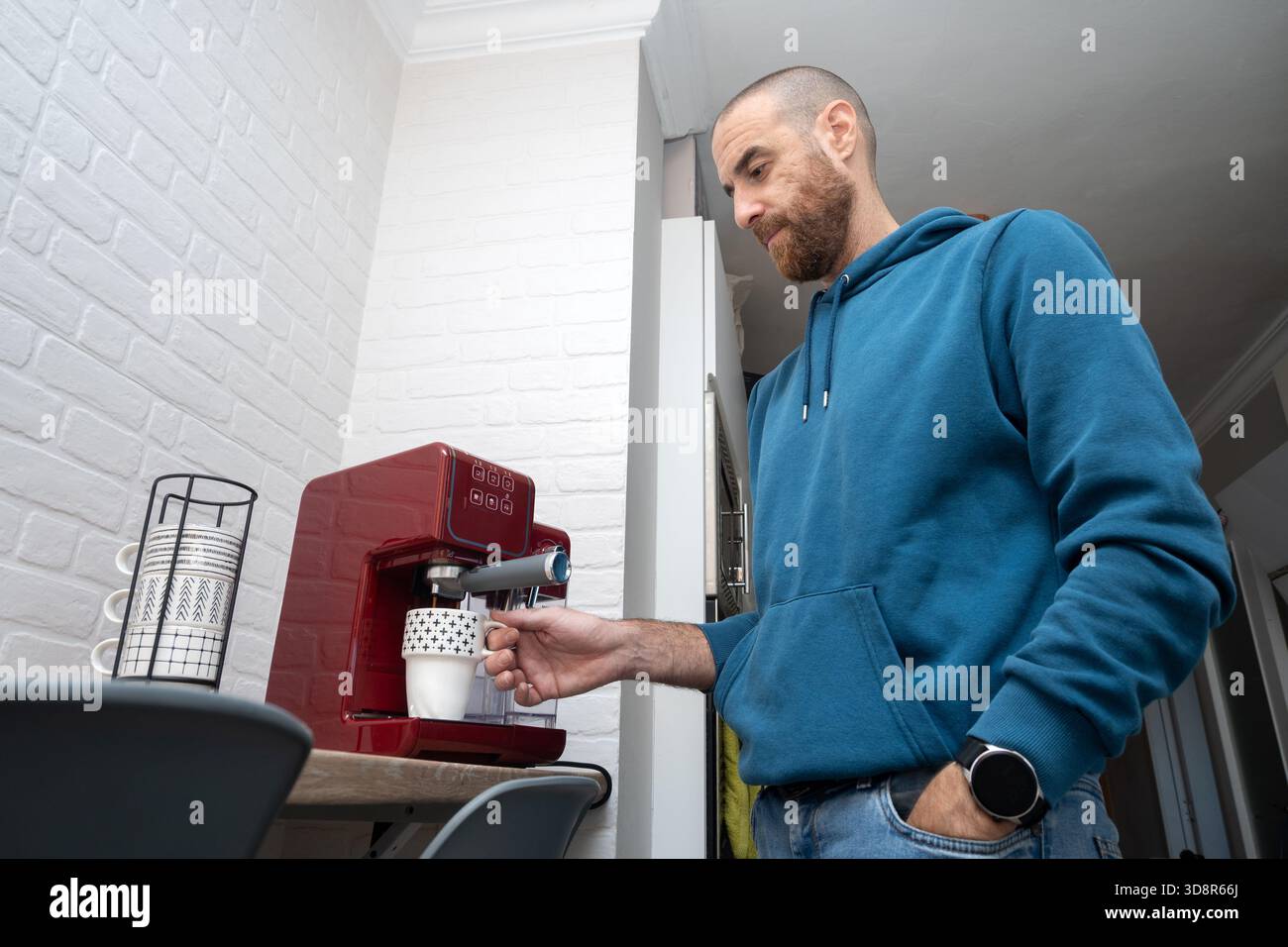 Man preparing coffee in his home kitchen Stock Photo