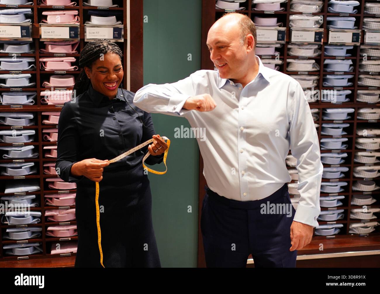 Conservative Party leader Kemi Badenoch measuring shadow business secretary Andrew Griffith for a shirt during a visit to Charles Tyrwhitt in central London. Picture date: Tuesday December 2, 2025. Stock Photo