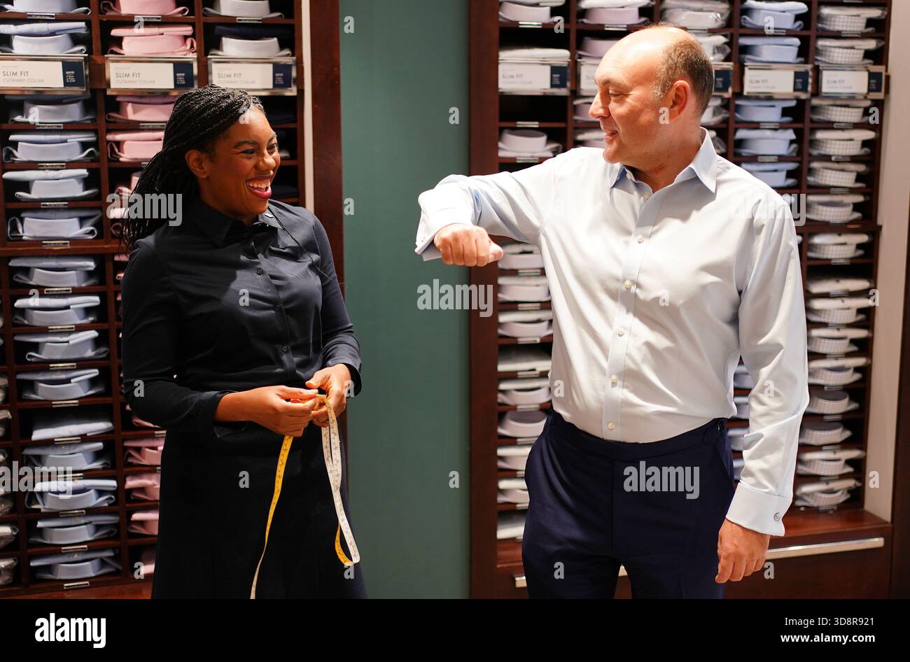 Conservative Party leader Kemi Badenoch measuring shadow business secretary Andrew Griffith for a shirt during a visit to Charles Tyrwhitt in central London. Picture date: Tuesday December 2, 2025. Stock Photo