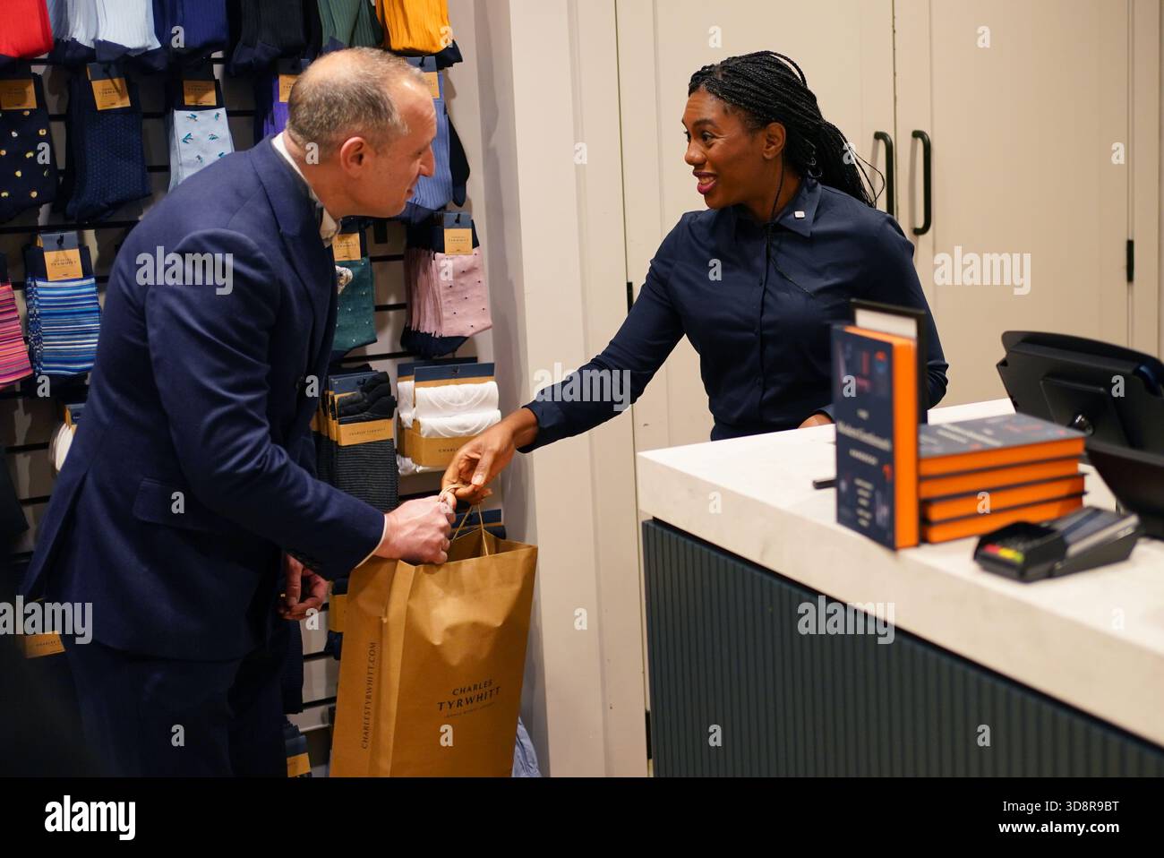 Conservative Party leader Kemi Badenoch with store manager Scott Barry during a visit to Charles Tyrwhitt in central London. Picture date: Tuesday December 2, 2025. Stock Photo