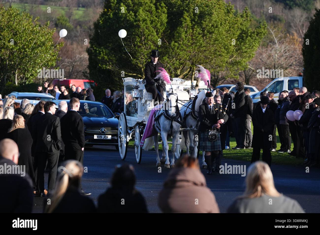 The coffin arrives by horse drawn hearse for the funeral of Chloe Hipson at Daldowie Crematorium in Glasgow. 21-year-old Chloe was one of five people killed when their Volkswagen Golf was in a collision with a Toyota Land Cruiser on a road near Dundalk on November 15. Picture date: Tuesday December 2, 2025. Stock Photo