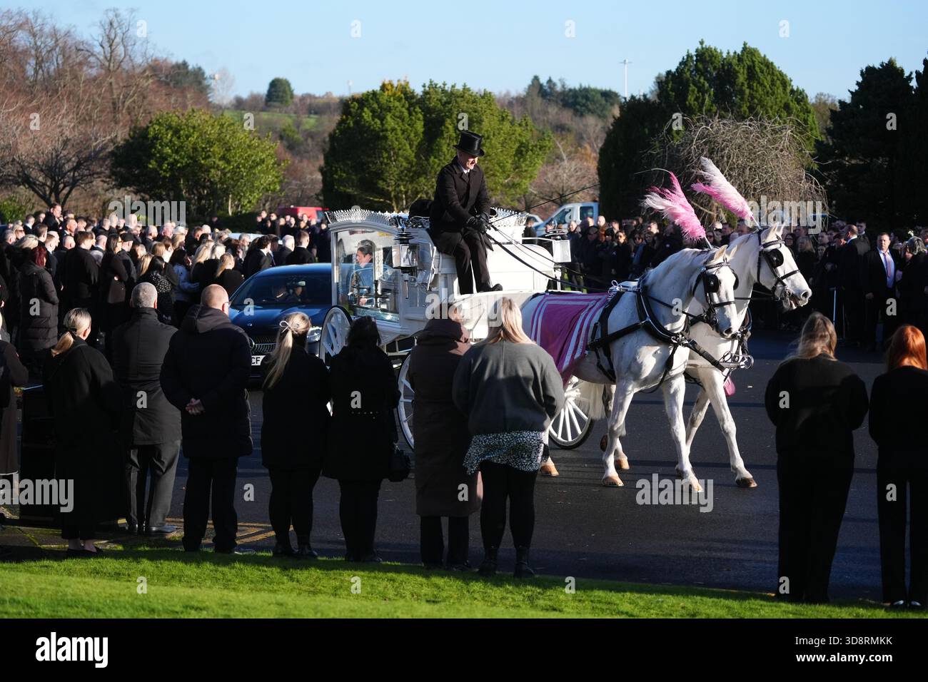 The coffin arrives by horse drawn hearse for the funeral of Chloe Hipson at Daldowie Crematorium in Glasgow. 21-year-old Chloe was one of five people killed when their Volkswagen Golf was in a collision with a Toyota Land Cruiser on a road near Dundalk on November 15. Picture date: Tuesday December 2, 2025. Stock Photo