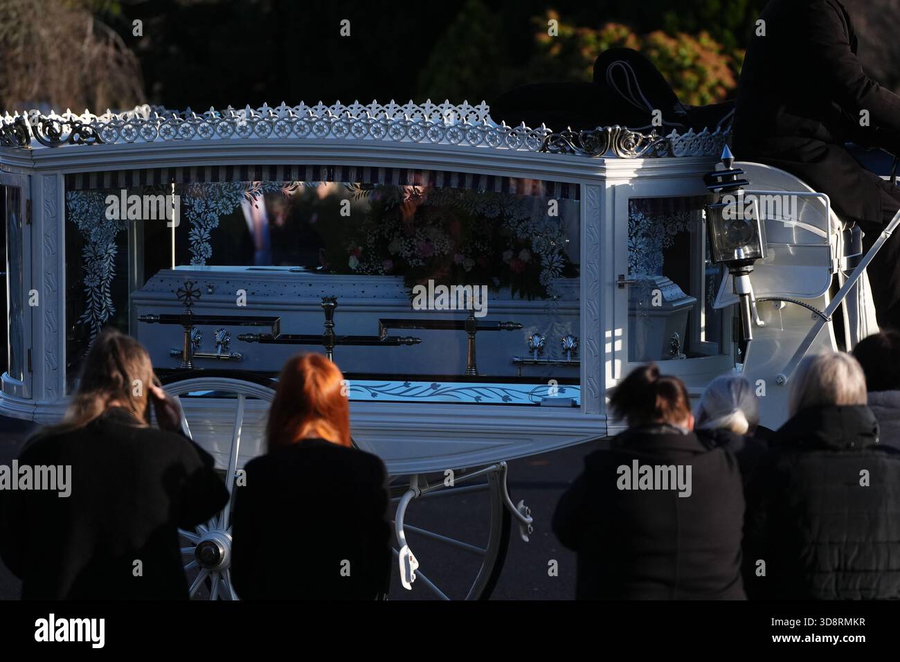 The coffin arrives by horse drawn hearse for the funeral of Chloe Hipson at Daldowie Crematorium in Glasgow. 21-year-old Chloe was one of five people killed when their Volkswagen Golf was in a collision with a Toyota Land Cruiser on a road near Dundalk on November 15. Picture date: Tuesday December 2, 2025. Stock Photo