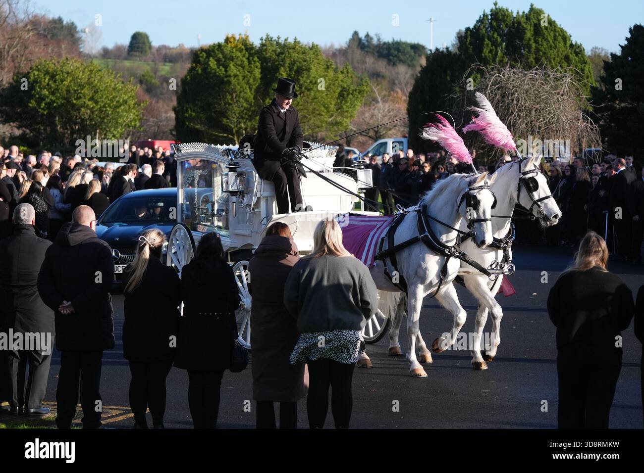 The coffin arrives by horse drawn hearse for the funeral of Chloe Hipson at Daldowie Crematorium in Glasgow. 21-year-old Chloe was one of five people killed when their Volkswagen Golf was in a collision with a Toyota Land Cruiser on a road near Dundalk on November 15. Picture date: Tuesday December 2, 2025. Stock Photo