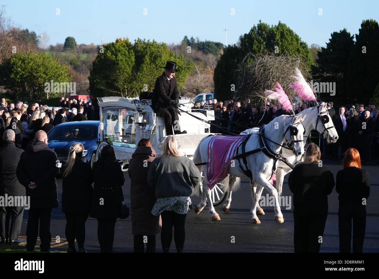 The coffin arrives by horse drawn hearse for the funeral of Chloe Hipson at Daldowie Crematorium in Glasgow. 21-year-old Chloe was one of five people killed when their Volkswagen Golf was in a collision with a Toyota Land Cruiser on a road near Dundalk on November 15. Picture date: Tuesday December 2, 2025. Stock Photo