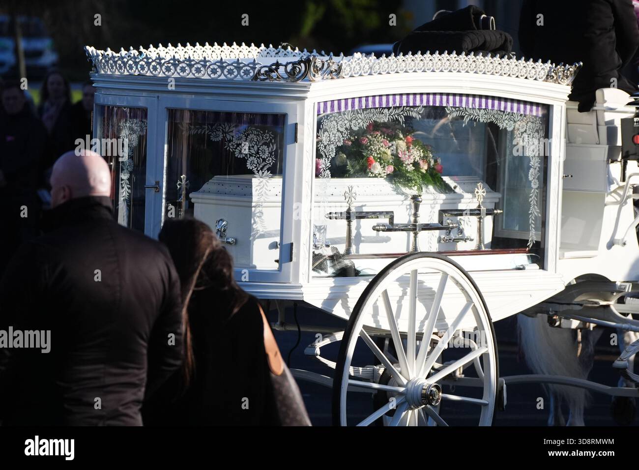 The coffin arrives by horse drawn hearse for the funeral of Chloe Hipson at Daldowie Crematorium in Glasgow. 21-year-old Chloe was one of five people killed when their Volkswagen Golf was in a collision with a Toyota Land Cruiser on a road near Dundalk on November 15. Picture date: Tuesday December 2, 2025. Stock Photo