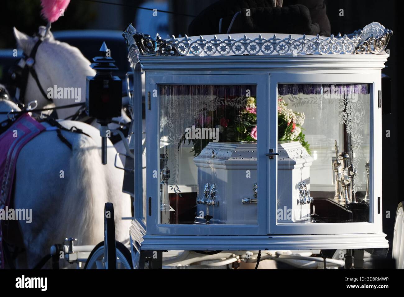 The coffin arrives by horse drawn hearse for the funeral of Chloe Hipson at Daldowie Crematorium in Glasgow. 21-year-old Chloe was one of five people killed when their Volkswagen Golf was in a collision with a Toyota Land Cruiser on a road near Dundalk on November 15. Picture date: Tuesday December 2, 2025. Stock Photo