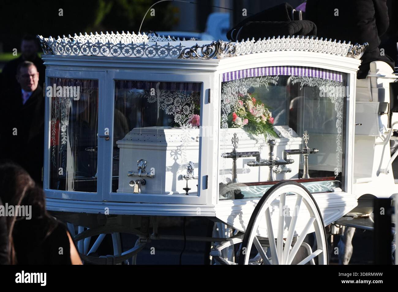 The coffin arrives by horse drawn hearse for the funeral of Chloe Hipson at Daldowie Crematorium in Glasgow. 21-year-old Chloe was one of five people killed when their Volkswagen Golf was in a collision with a Toyota Land Cruiser on a road near Dundalk on November 15. Picture date: Tuesday December 2, 2025. Stock Photo