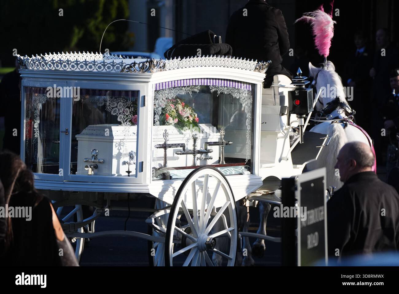 The coffin arrives by horse drawn hearse for the funeral of Chloe Hipson at Daldowie Crematorium in Glasgow. 21-year-old Chloe was one of five people killed when their Volkswagen Golf was in a collision with a Toyota Land Cruiser on a road near Dundalk on November 15. Picture date: Tuesday December 2, 2025. Stock Photo