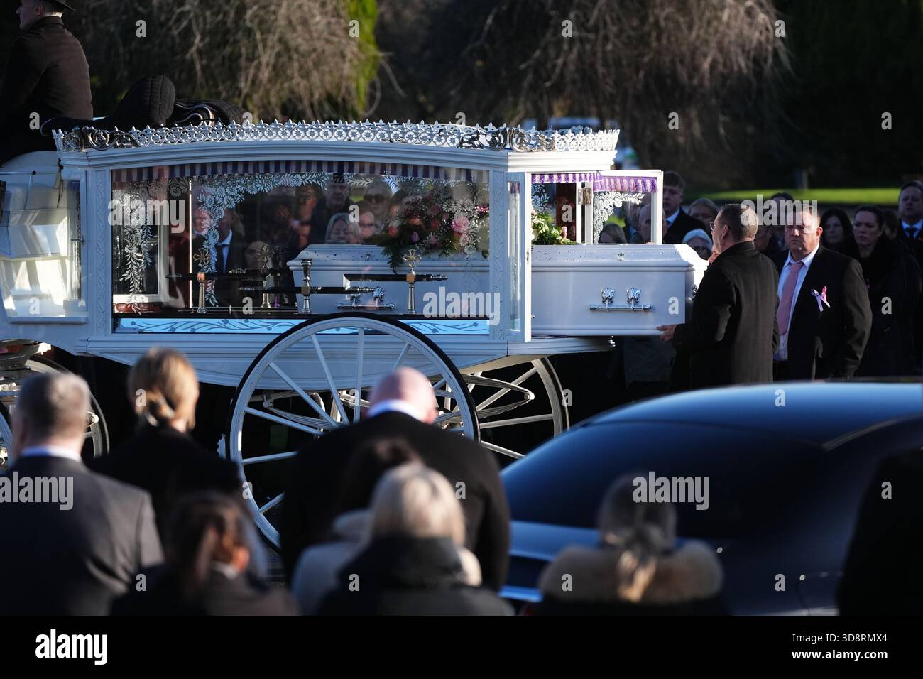 The coffin arrives by horse drawn hearse for the funeral of Chloe Hipson at Daldowie Crematorium in Glasgow. 21-year-old Chloe was one of five people killed when their Volkswagen Golf was in a collision with a Toyota Land Cruiser on a road near Dundalk on November 15. Picture date: Tuesday December 2, 2025. Stock Photo